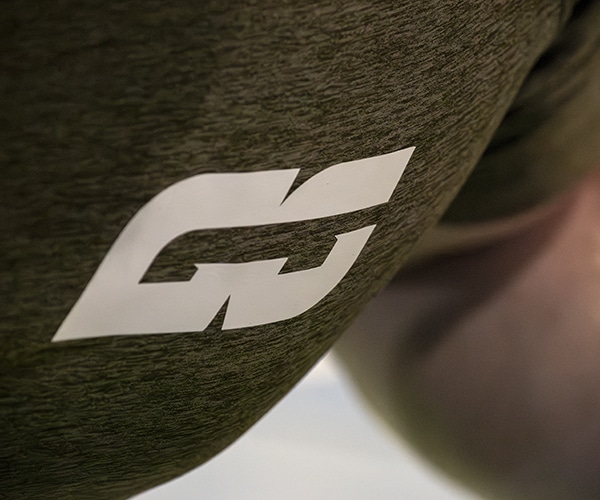 GS logomark on green t-shirt